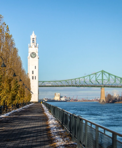 clock tower and jacques cartier bridge at old port